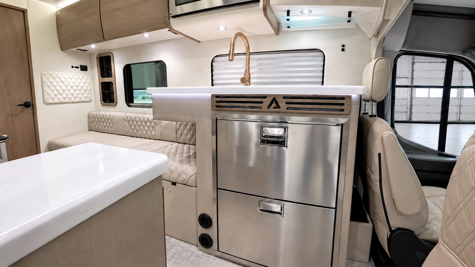The Alliance RV Model B kitchen has two stainless refrigerator drawers, shown closed beneath the counter.
