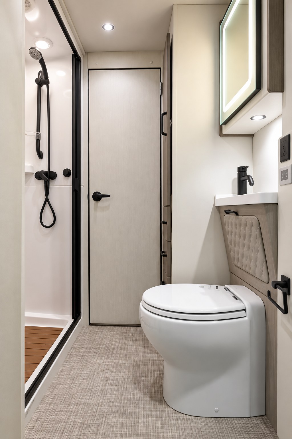 Alliance RV Model B rear bathroom with separate shower and porcelain toilet