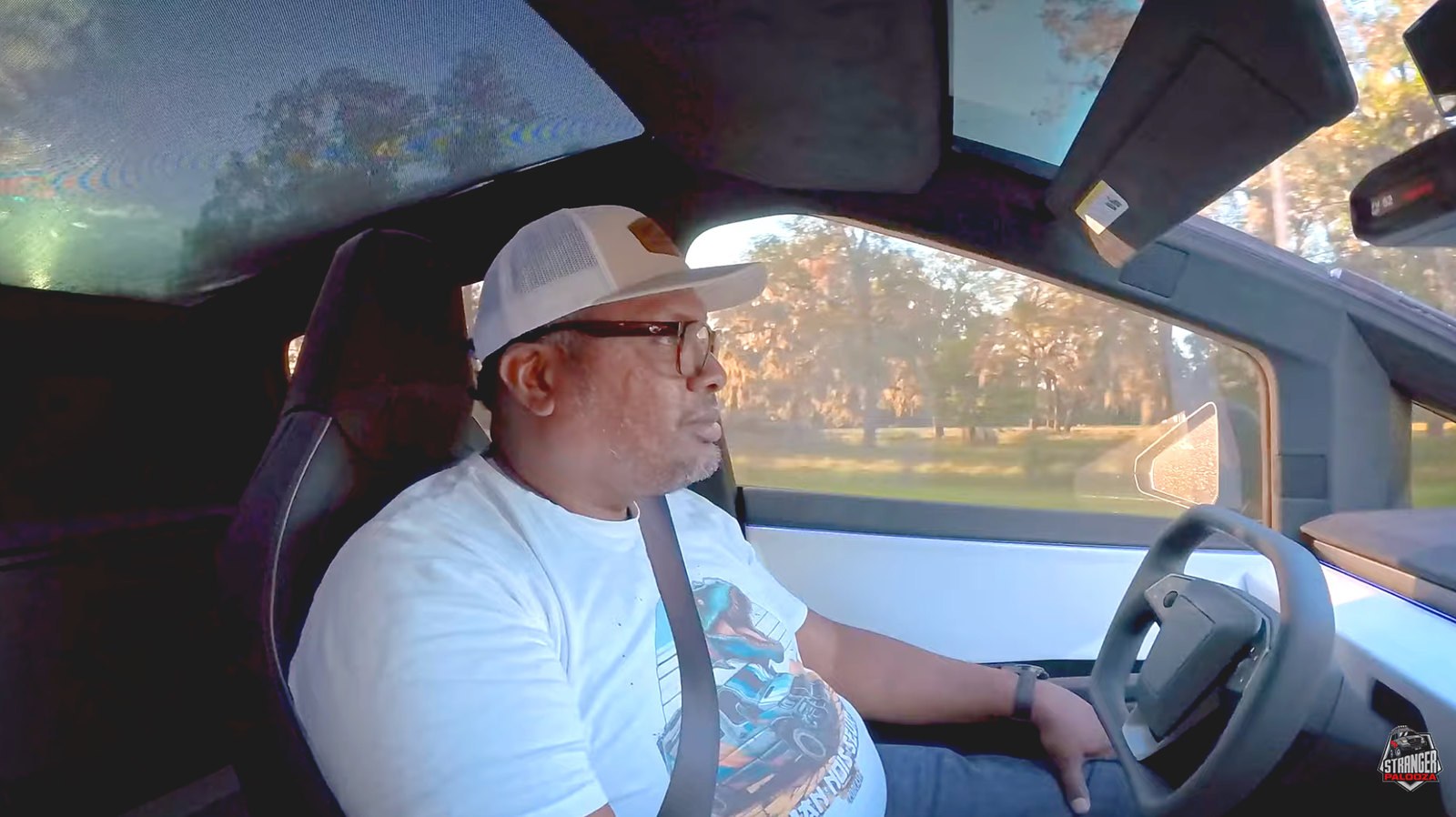 Hank Strange in the driver's seat of his Tesla Cybertruck