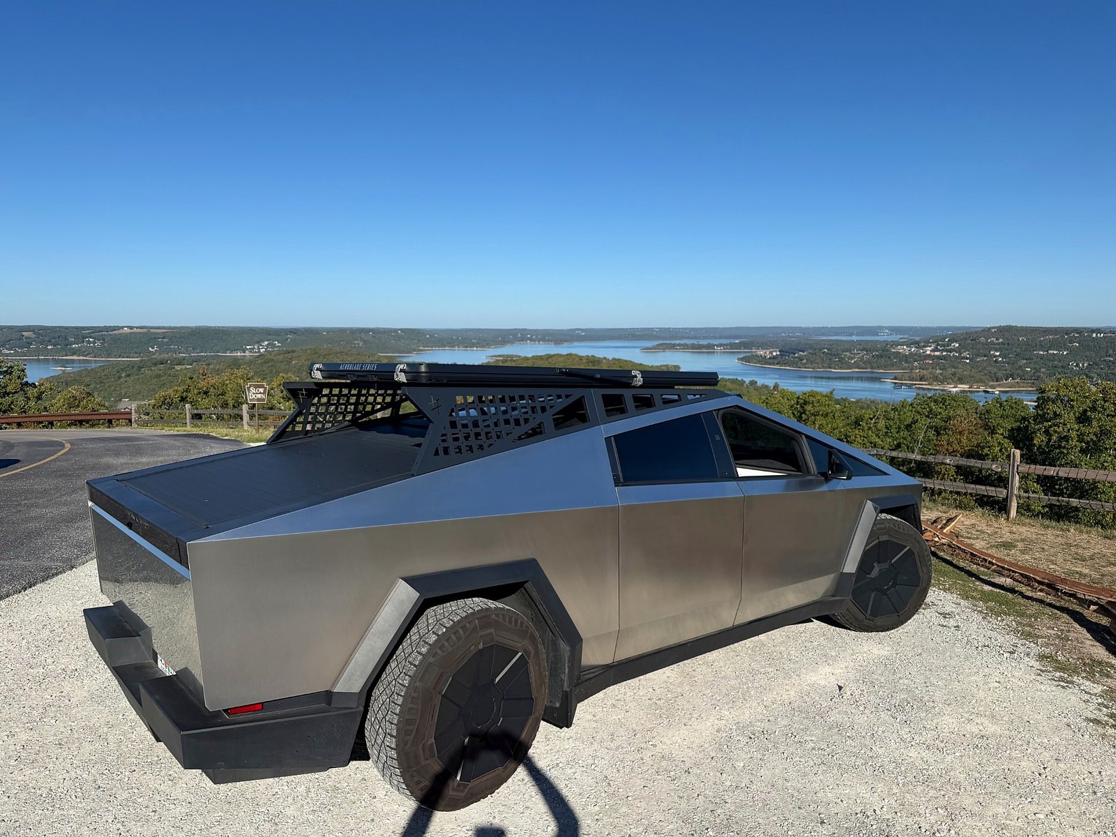 Tesla Cybertruck parked at the lakeside during Hank and Lola's travels