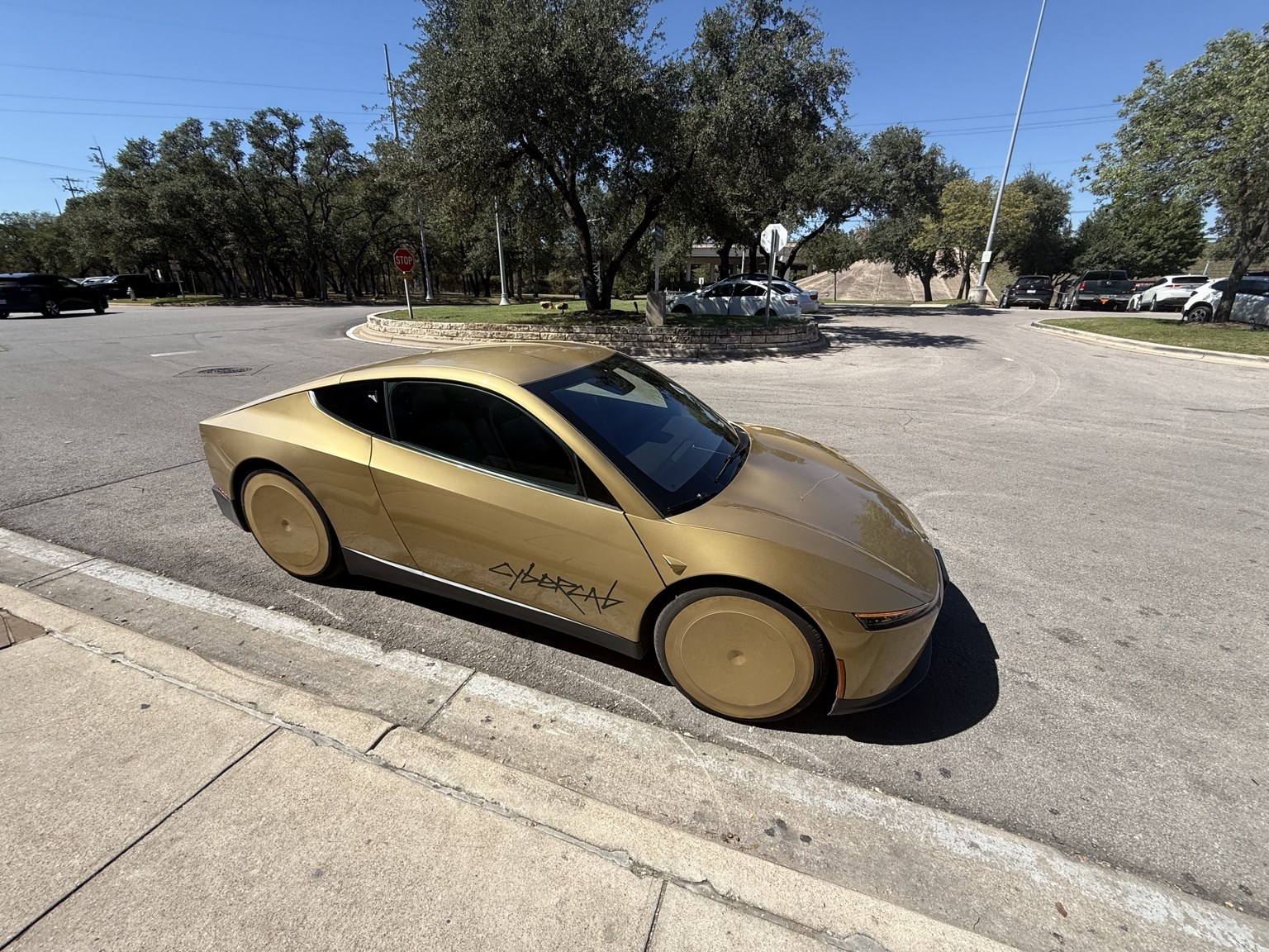Side profile of Tesla's gold Cybercab